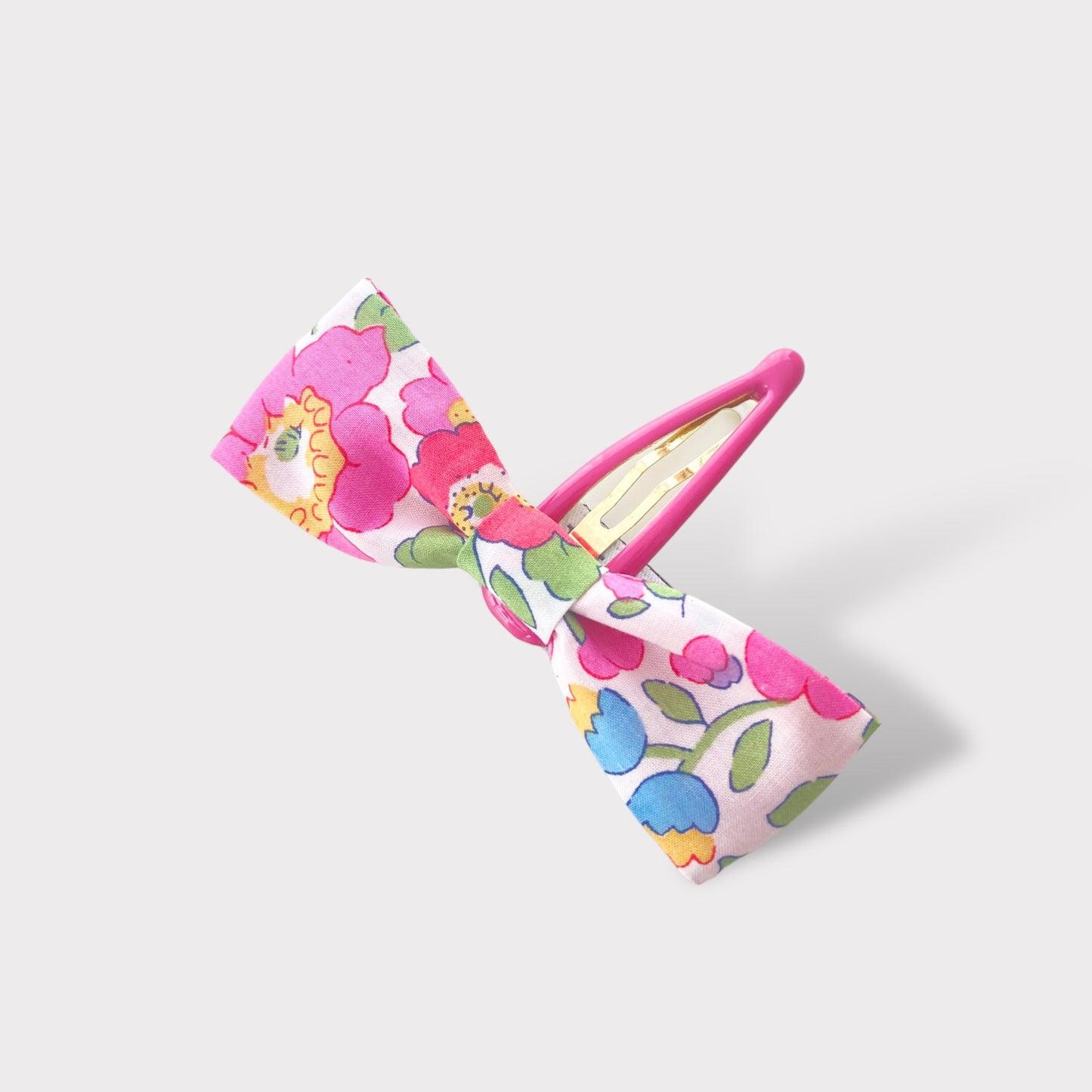 Fermaglio con fiocco in tessuto liberty