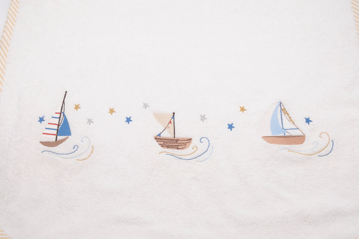 Terry bathrobe poncho with embroidered boats and stars