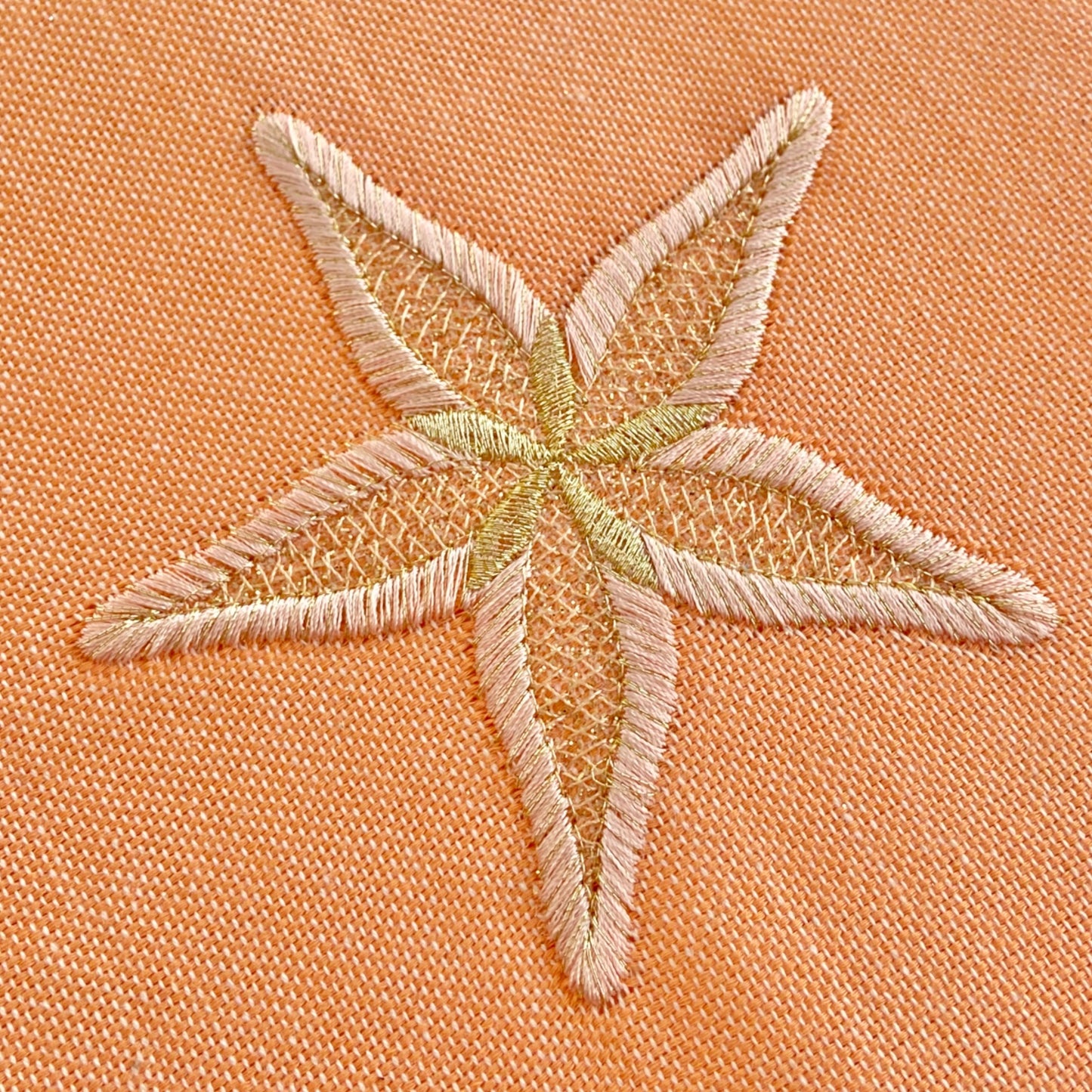 Telo mare fouta con stella marina color oro.