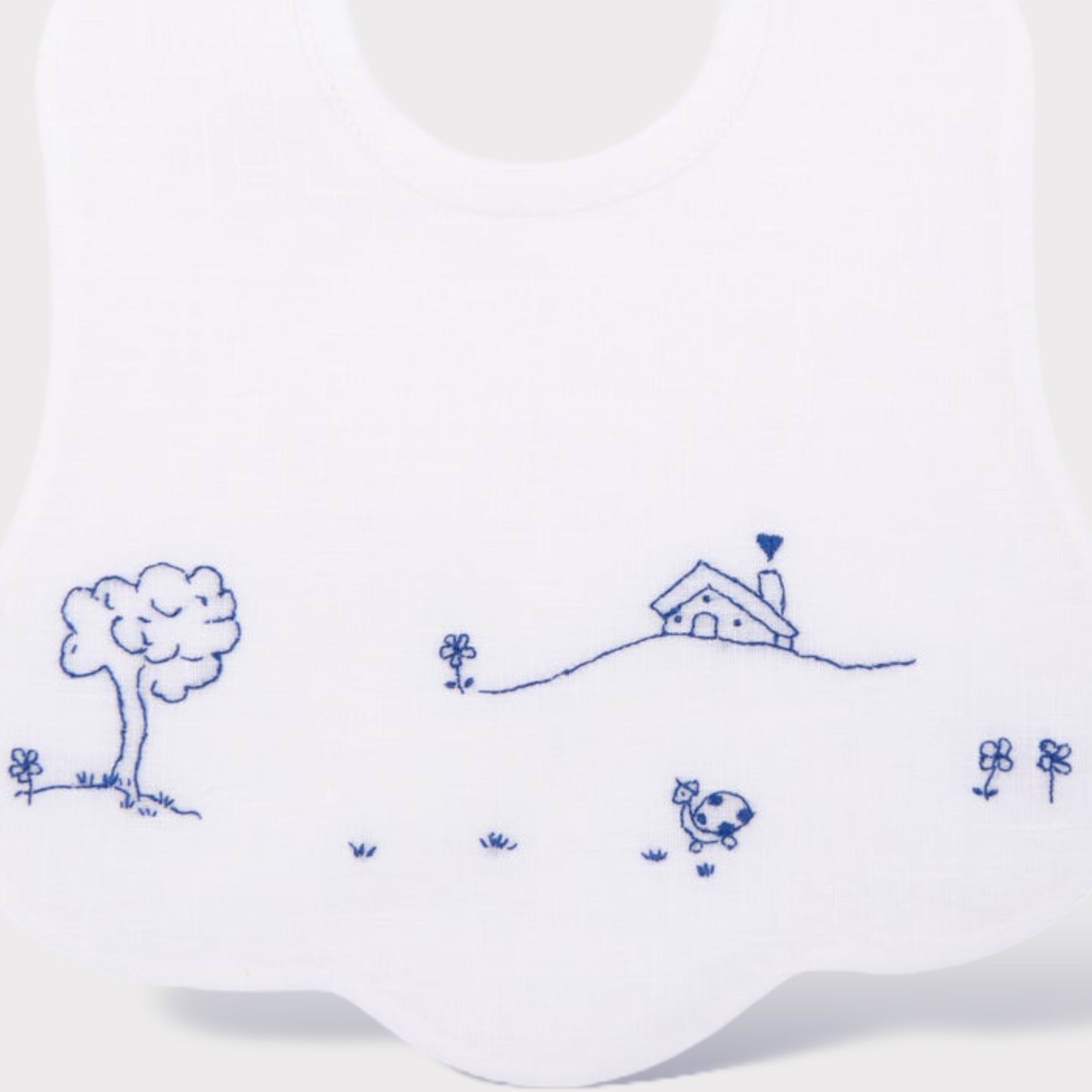 Bavaglino con ricamo a mano blu