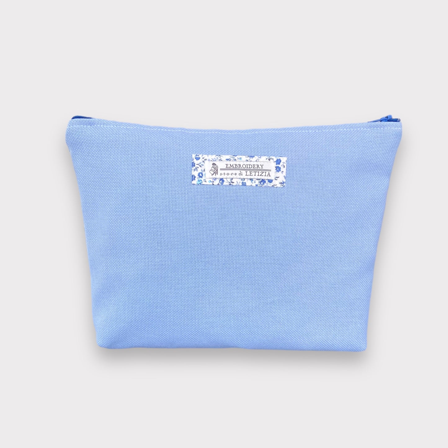 retro pochette azzurro polvere con dettaglio tessuto liberty