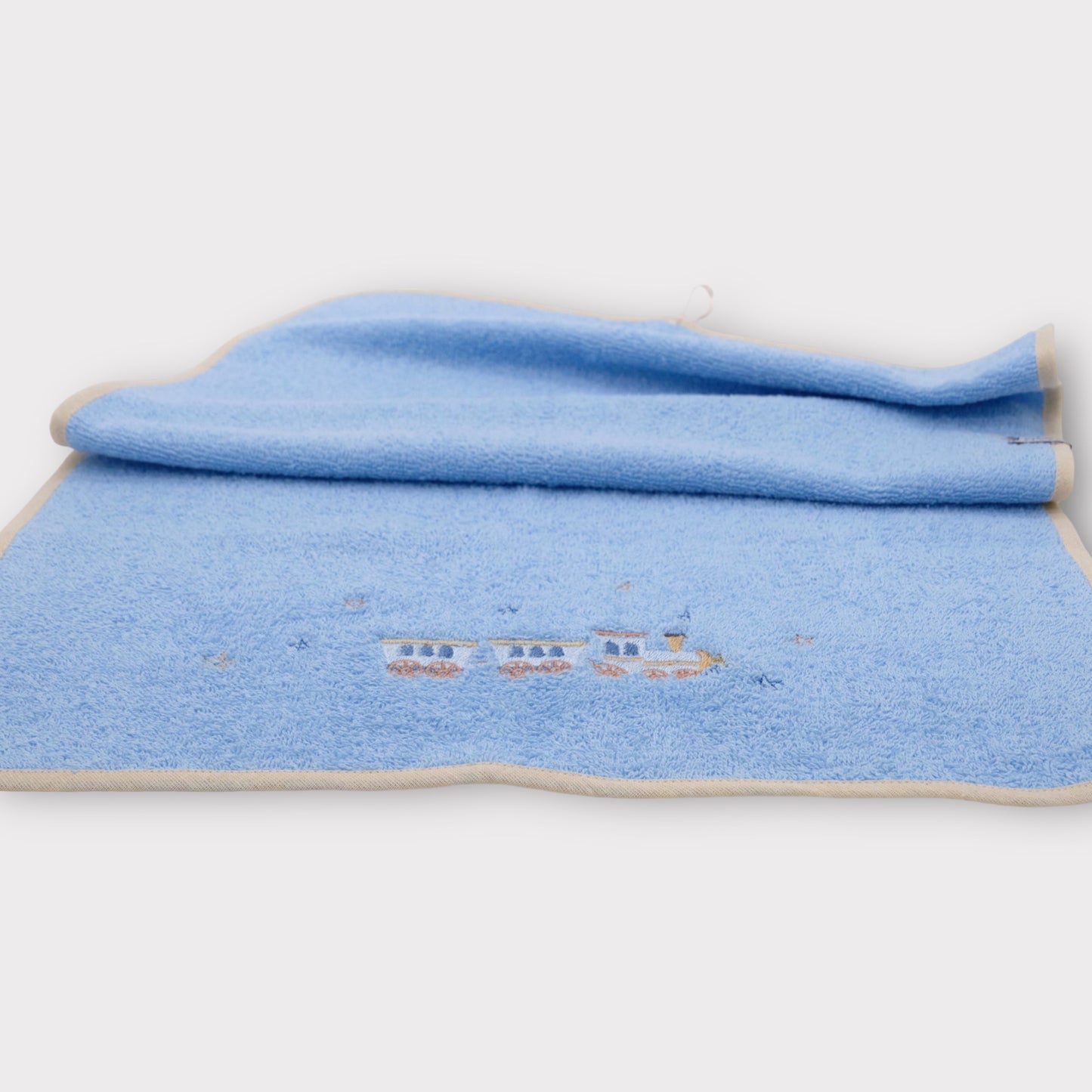 Light blue terry towel with embroidery - little train and stars