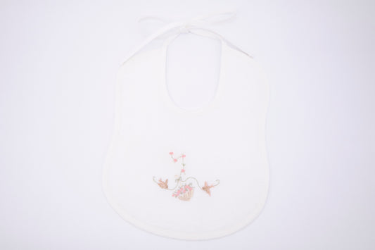 Bib with hand embroidery - umbrella flowers and swallows