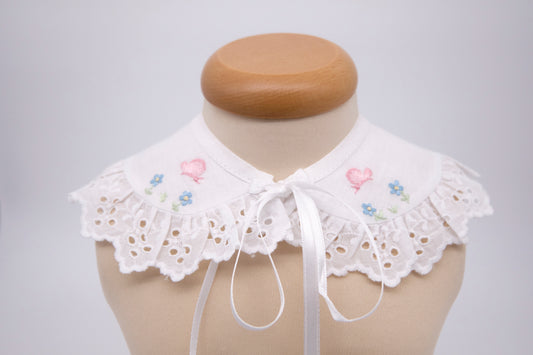 Collar in pure linen hand embroidered with blue flowers and pink butterflies